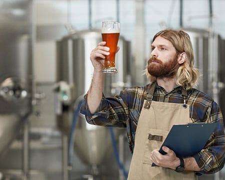 brew master inspecting beer